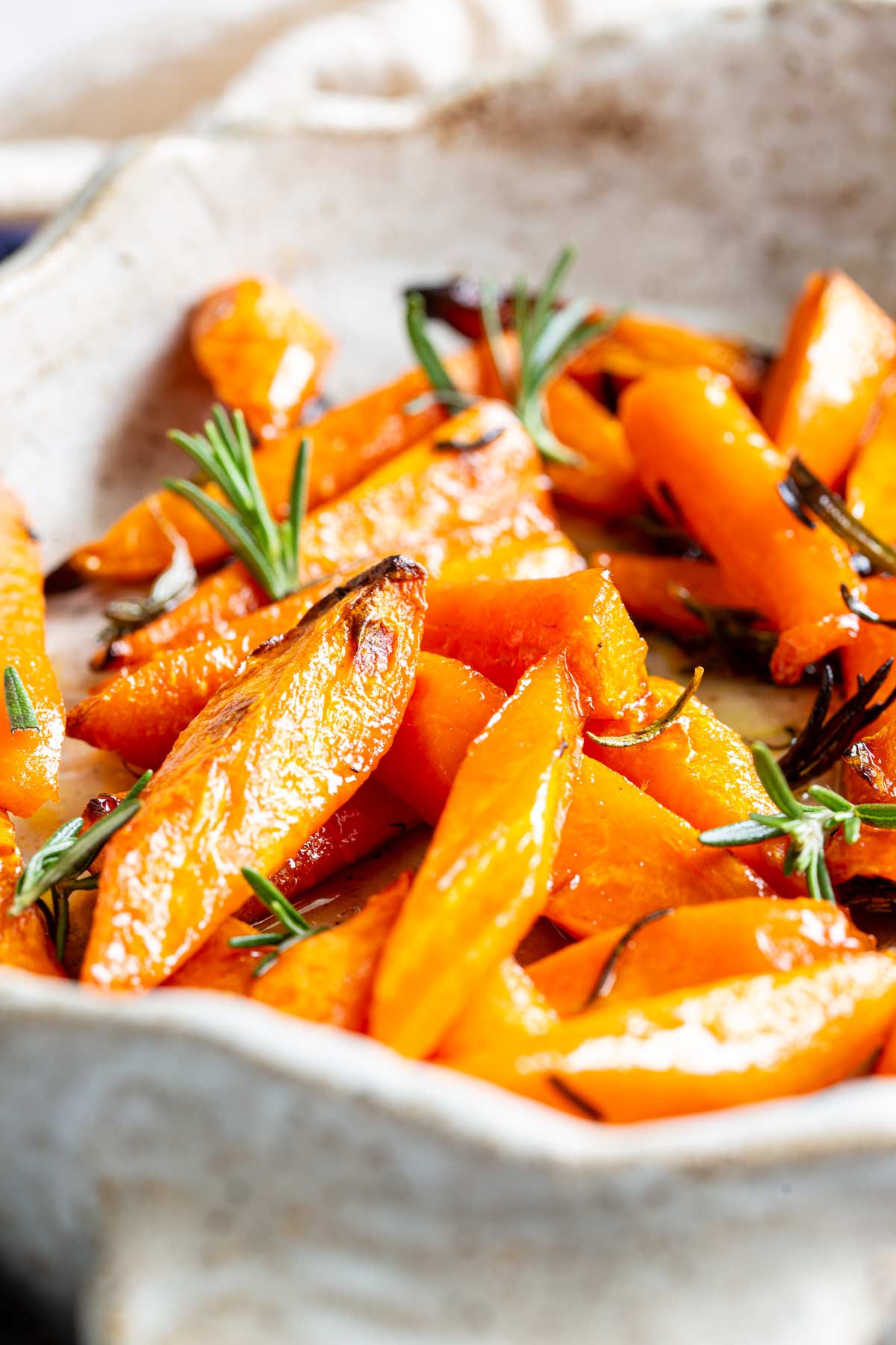 close up on the burnished colour of roasted carrots