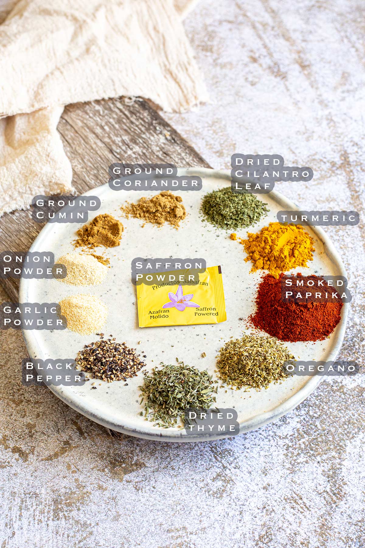 the ingredients for a Spanish seasoning portioned on a plate