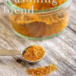 Pin Image: Glass jar and spoon of Spanish seasoning with text overlaid