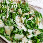 pin image: A rocket salad on a rustic plate with text overlaid