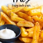 Pin Image: Cajun Fries on a plate with mayonnaise. Text overlaid