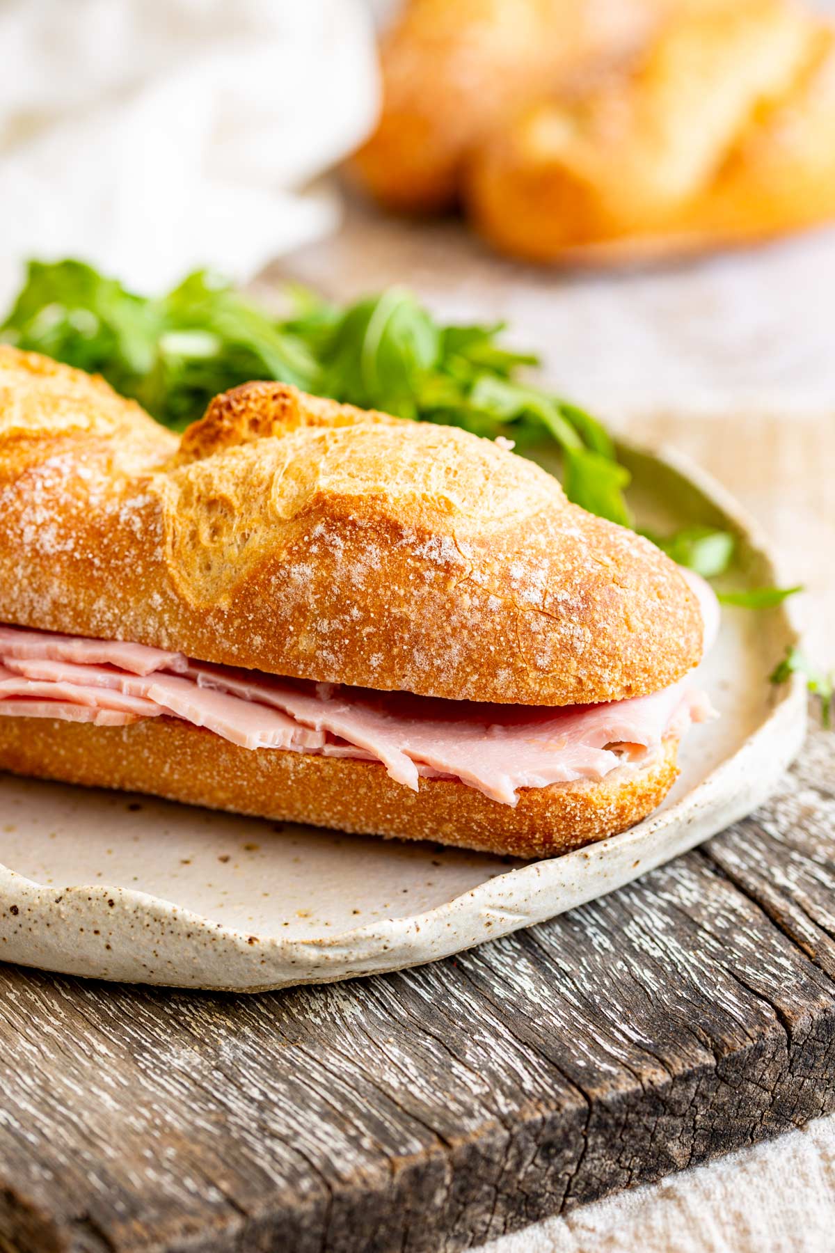 a French ham sandwich on a stoneware plate