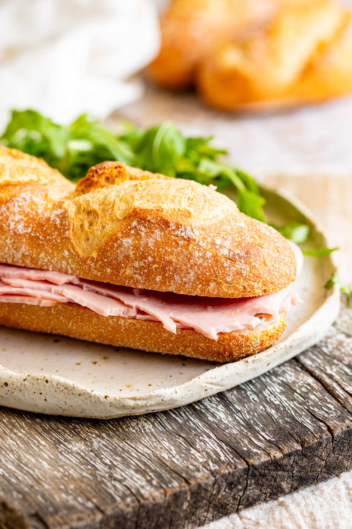 a French ham sandwich on a stoneware plate