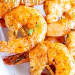 pin image: peri peri shrimp in a white dish with text overlaid