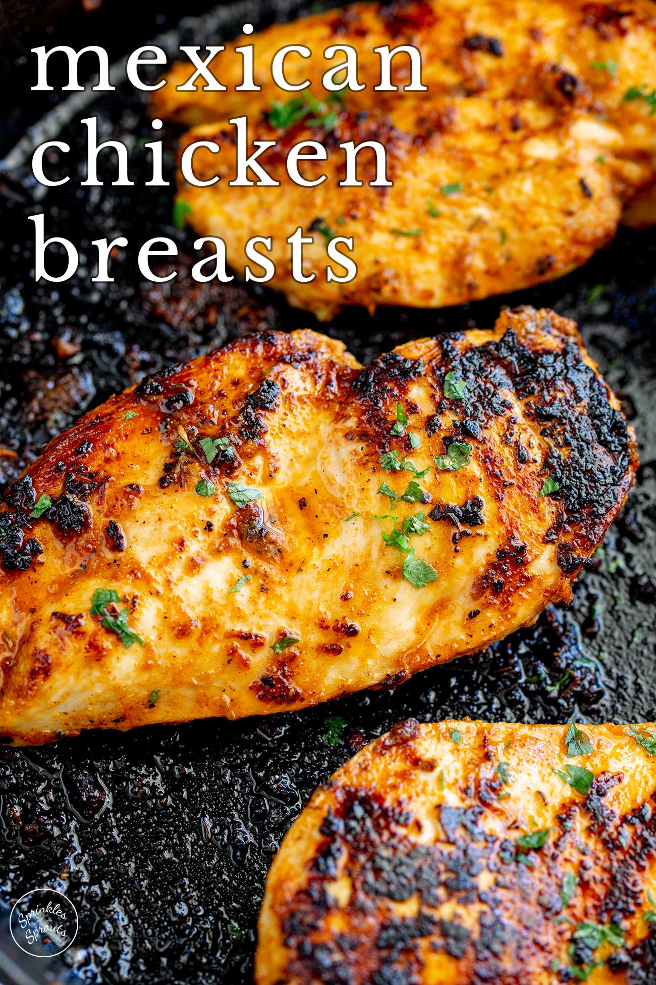 pin image: cooked chicken breasts with seasoning on them with text overlaid