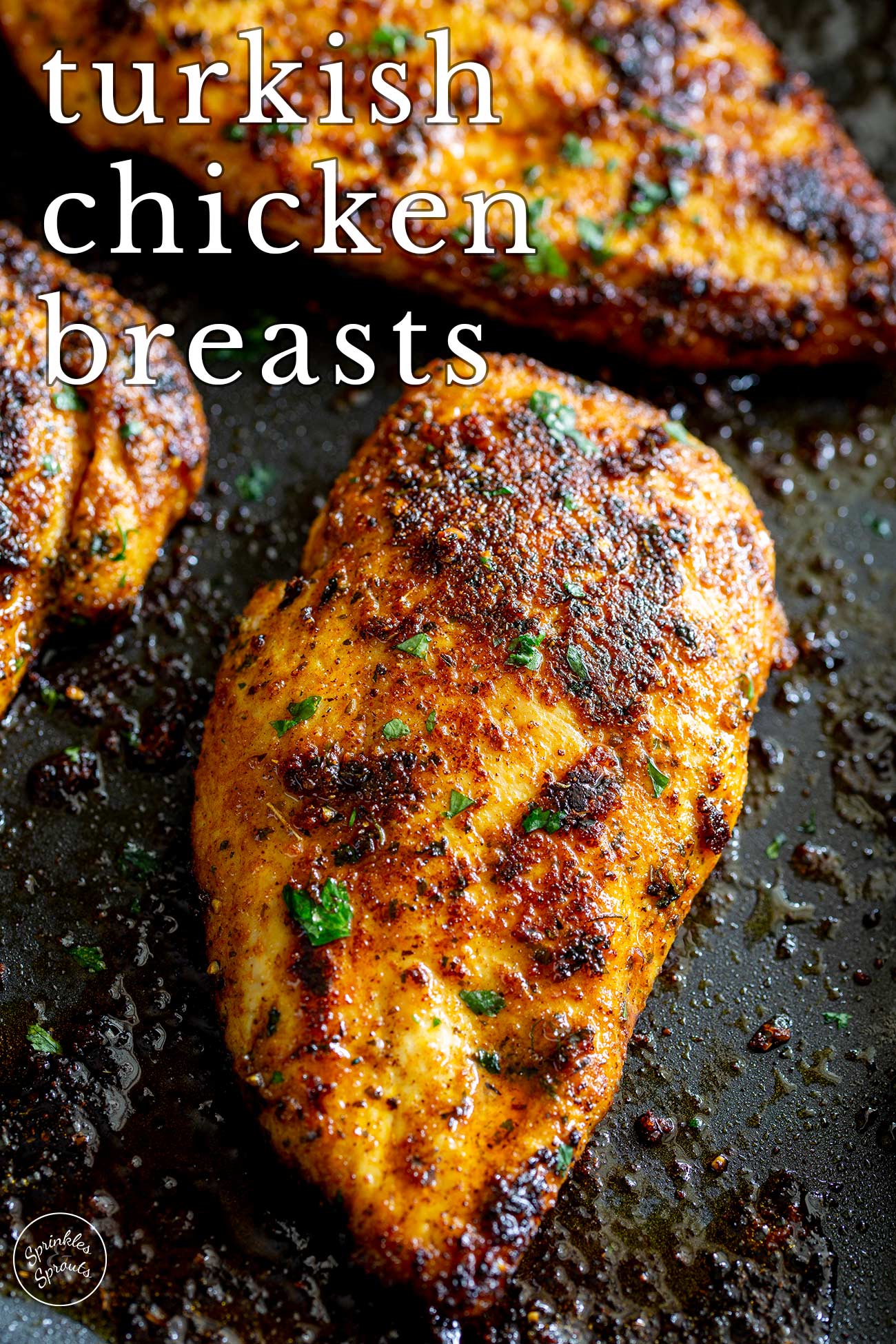 pin image: a seasoned cooked chicken breast in a black skillet with text overlaid