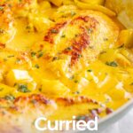 pin image: Curried chicken beasts in a skillet with text overlaid