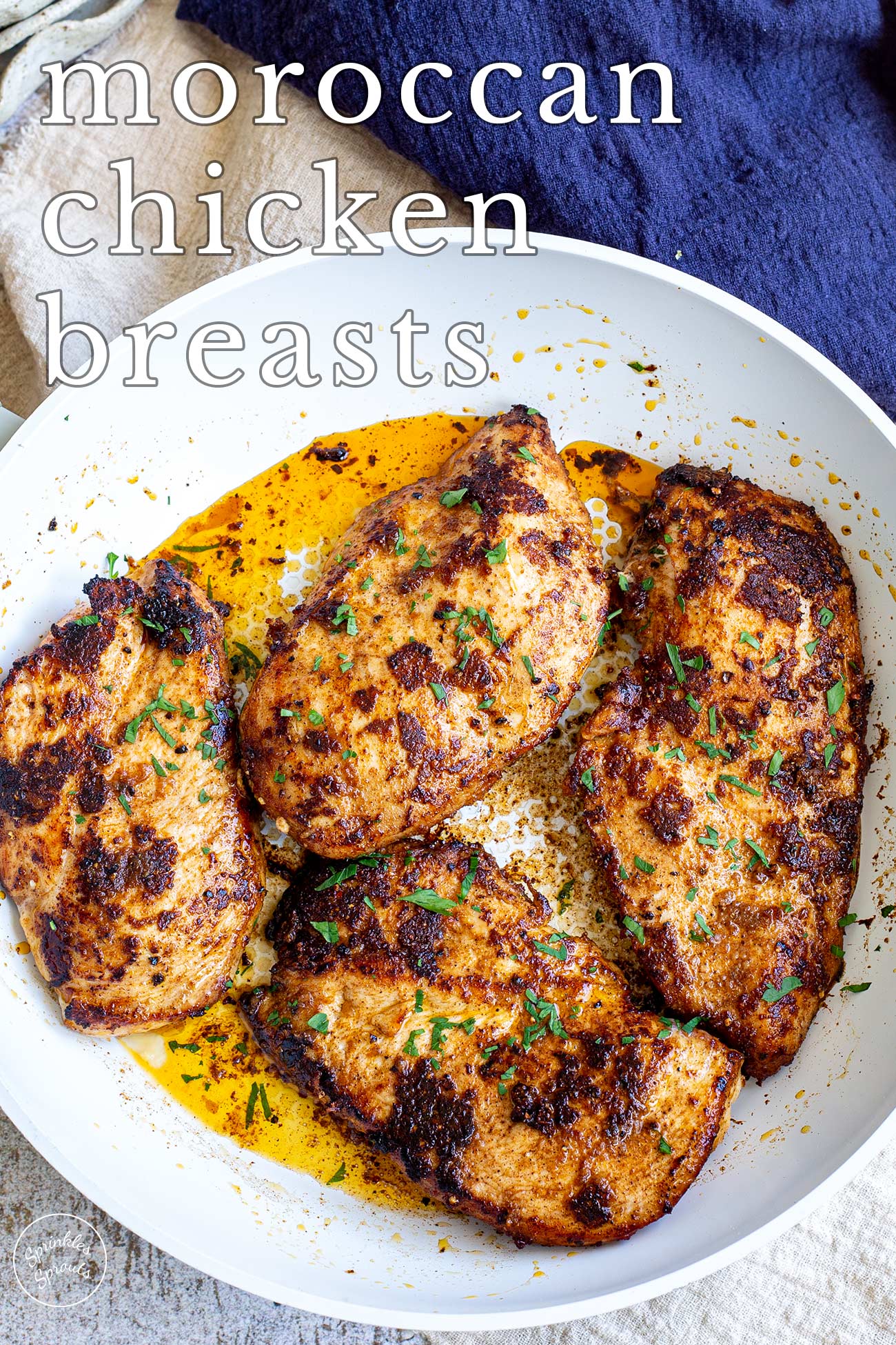 pin image: Moroccan chicken breasts in a skillet with text overlaid
