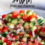 pin image: Moroccan tomato salad on a spoon with text overlaid