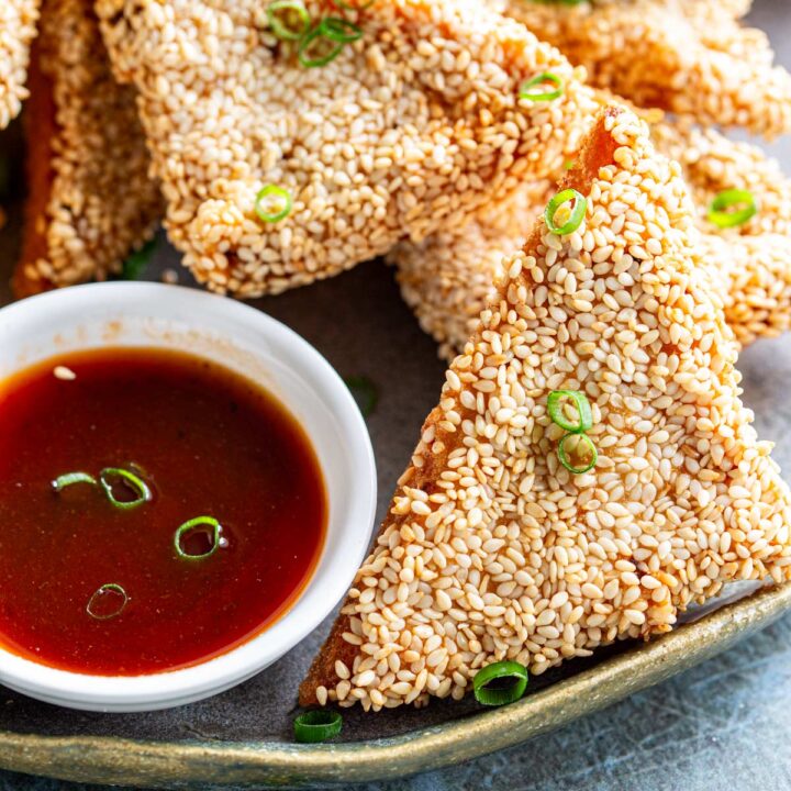 super close up on a triangle of sesame chicken toast