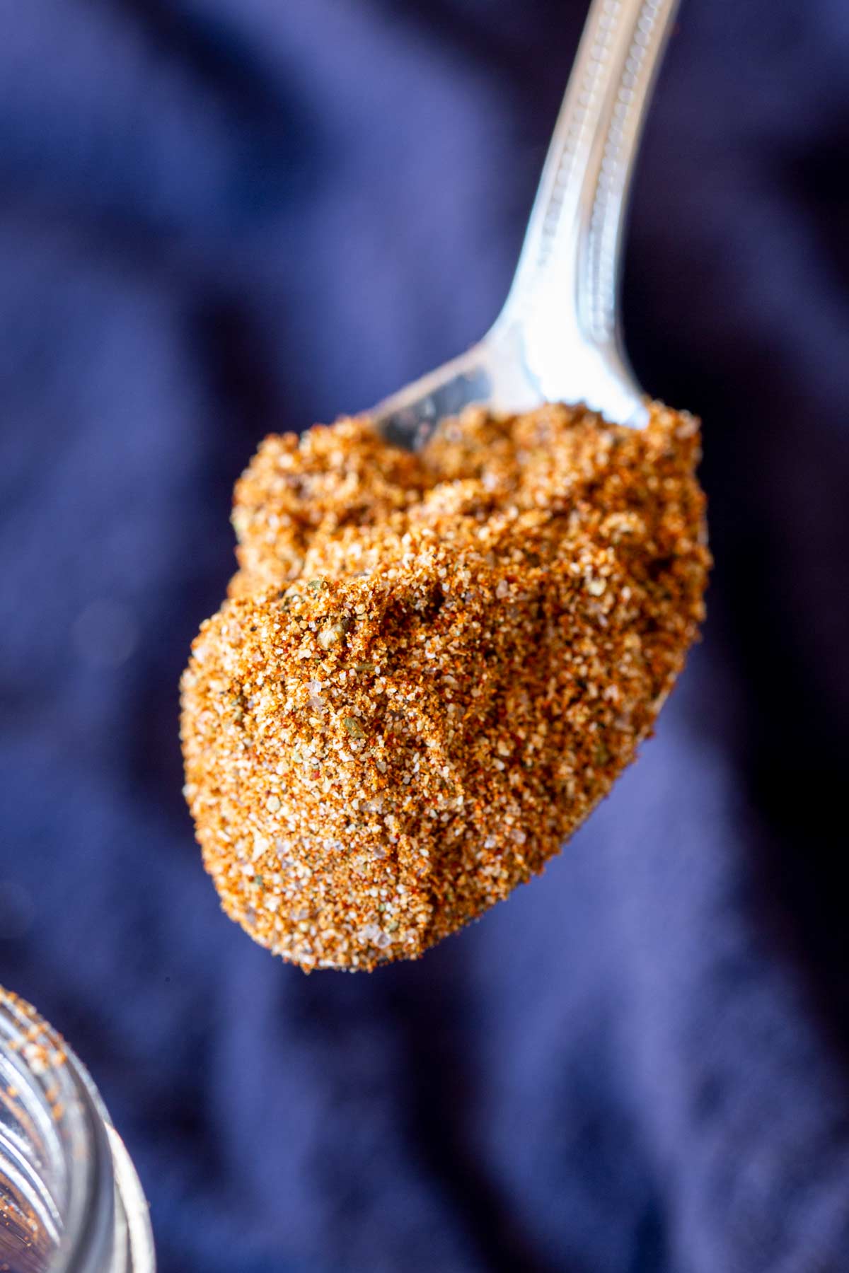 a spoon holing a scoop of chicken taco seasoning