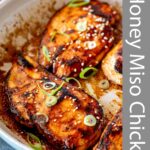 pin image: Honey Miso Chicken in a skillet with text overlaid