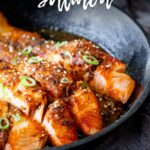 Pin Image: Miso butter salmon in a black skillet with text overlaid