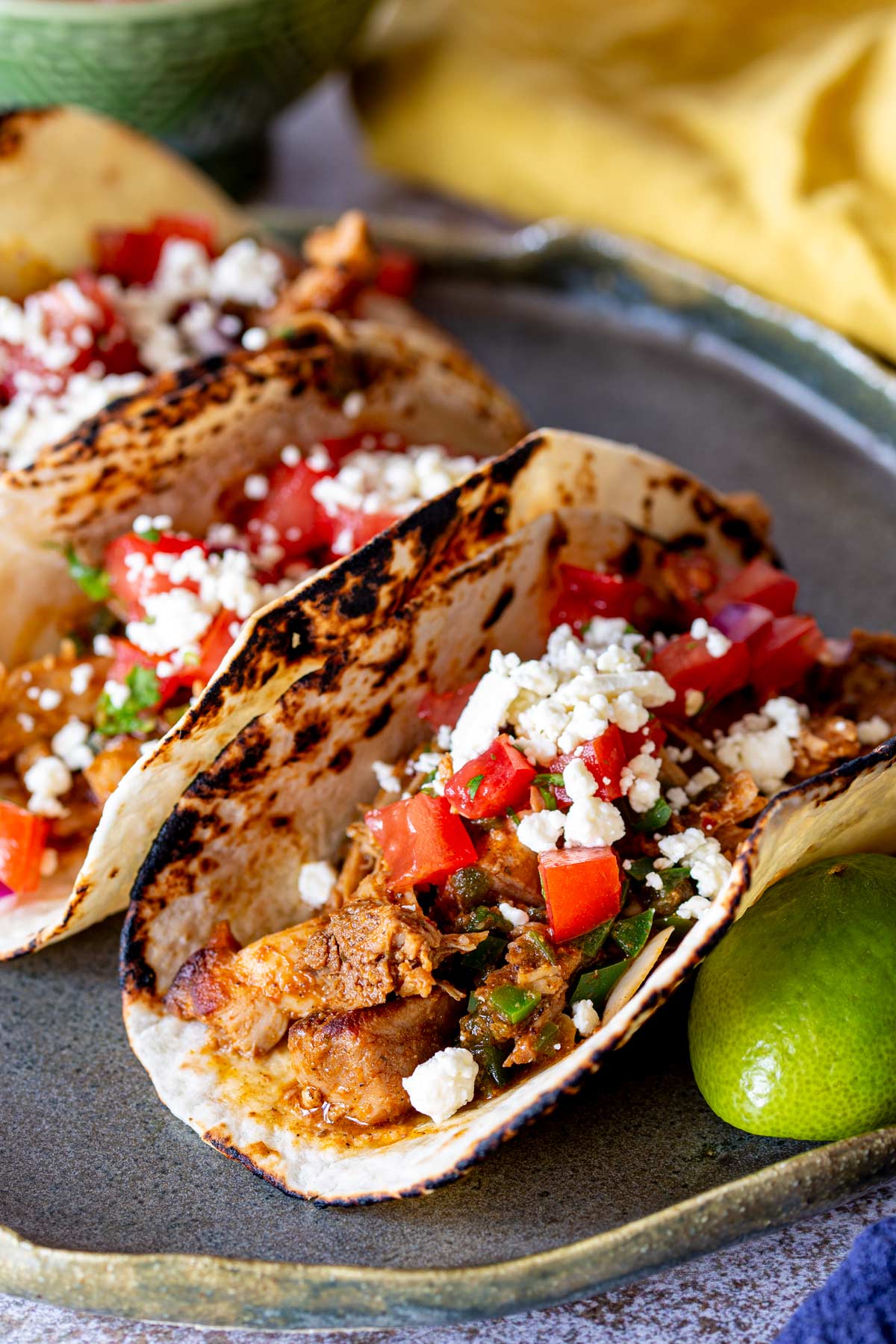 charred flour tortillas stuffed with chicken, tomato, red onion and queso fresco