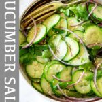 Pin Image: A bowl of asian cucumber salad with red onions with text overlaid