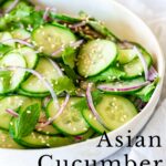 Pin Image: A bowl of asian cucumber salad with red onions with text overlaid