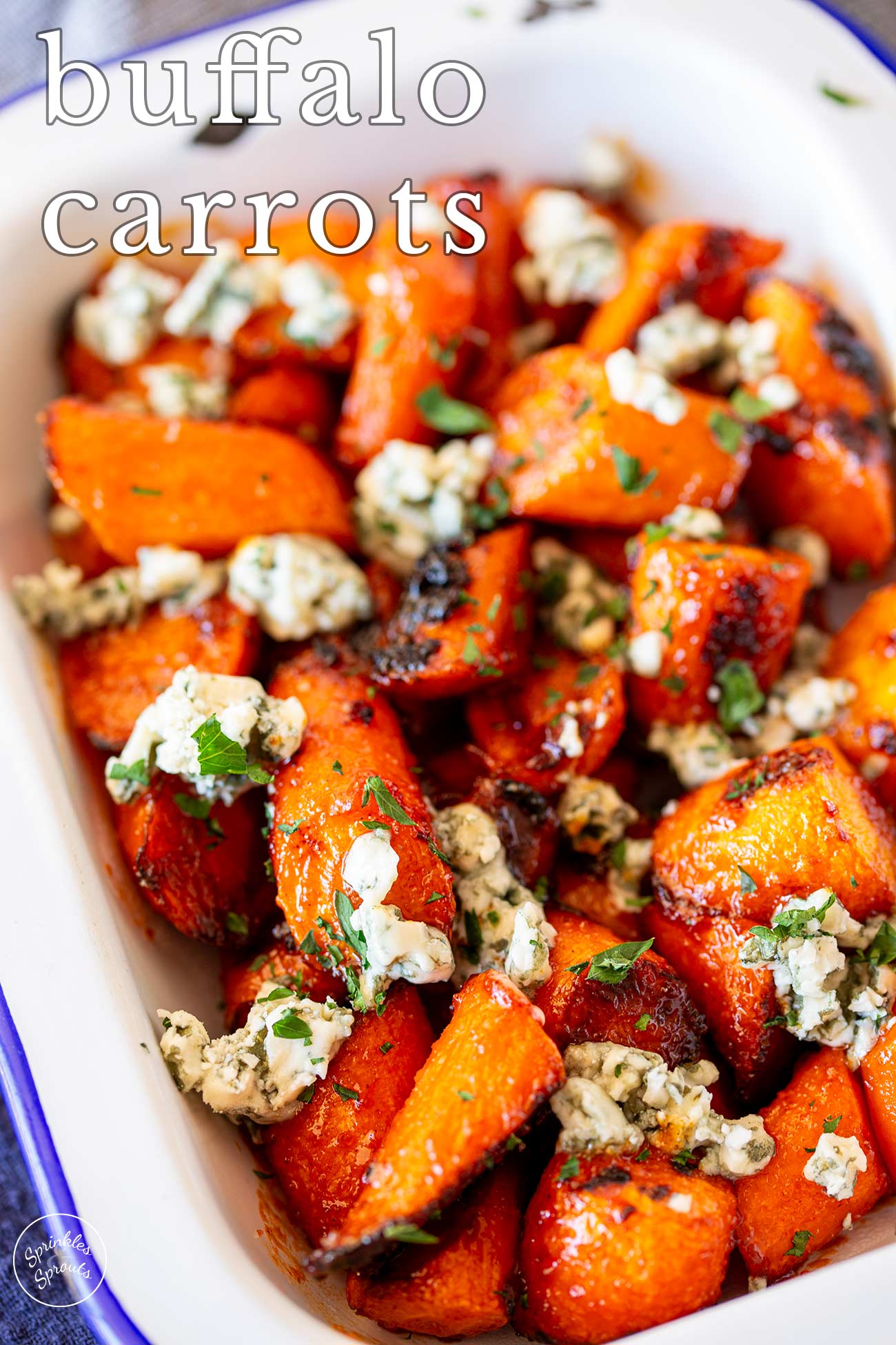 pin image: Roasted buffalo carrots topped with blue cheese with text overlaid