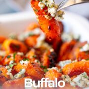 pin image: Roasted buffalo carrots topped with blue cheese with text overlaid