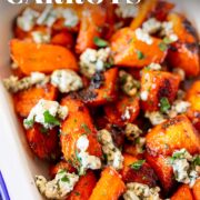pin image: Roasted buffalo carrots topped with blue cheese with text overlaid