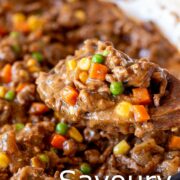 pin image: savoury mince in a skillet with a wooden spoon and text overlaid
