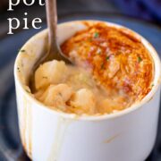 pin image: Spoon inside a seafood pot pie with text overlaid