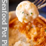 pin image: Fork with seafood pot pie filling with text overlaid