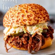 Pin Image: BBQ beef sandwich with pickles and slaw. With text overlaid