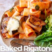Pin Image: Plate of baked rigatoni alla Norma with side salad with text overlaid