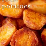 Pin Image: Close up of a bowl of roasted potatoes in a rustic dish with text overlaid