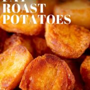 Pin Image: Close up of a bowl of roasted potatoes in a rustic dish with text overlaid