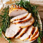 Pin Image: Sliced turkey breast on a plate with fresh rosemary with text overlaid