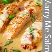 Pin Image: Salmon fillets in a creamy sun-dried tomato sauce with basil, with text overlaid
