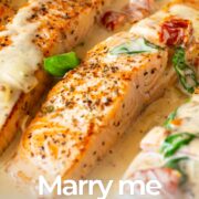 Pin Image: Salmon fillets in a creamy sun-dried tomato sauce with basil, with text overlaid