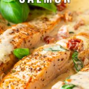 Pin Image: Salmon fillets in a creamy sun-dried tomato sauce with basil, with text overlaid