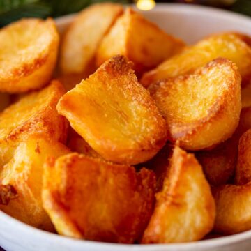 Close-up of roasted potato chunks showing their crisp texture and caramelized surfaces.