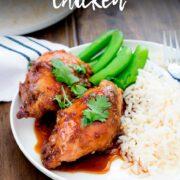 Pin Image: Sticky Coconut Chicken on a plate with rice and text overlaid