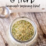 Pin Image: A glass jar of garlic and herb seasoning with text overlaid