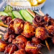 pin image: air fryer chicken shawarma skewers on a rustic blue grey plate with text overlaid