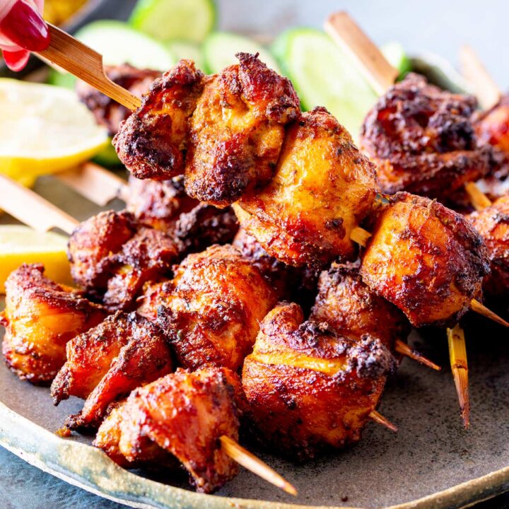 A detailed close-up of air fryer chicken shawarma skewers, highlighting the charred, spiced surface and juicy texture.