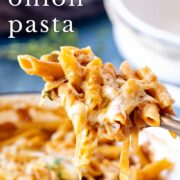 Pin Image: Spoon scooping cheesy French onion pasta with text overlaid