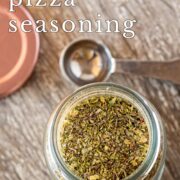 Pin Image: Pizza seasoning in a glass jar with text overlaid
