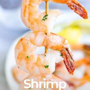 Pin Image: Shrimp skewer held upright with text overlaid