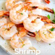 Pin Image: Shrimp skewers on serving plate with text overlaid