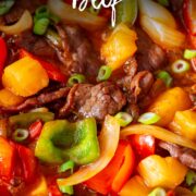 Pin Image: Sweet and sour beef and veg in a wok with text overlaid