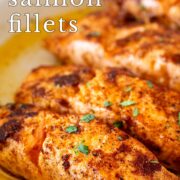 Pin Image: Pan-fried Moroccan salmon in skillet with text overlaid