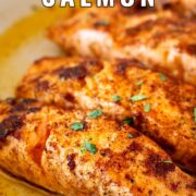 Pin Image: Pan-fried Moroccan salmon in skillet with text overlaid