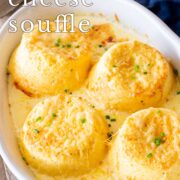 Pin Image: Four cheese soufflés in rustic white baking dish with text overlaid