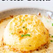 Pin Image: Twice baked cheese soufflé in beige dish with text overlaid