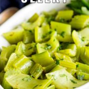 Pin Image: braised celery in a white dish with text overlaid
