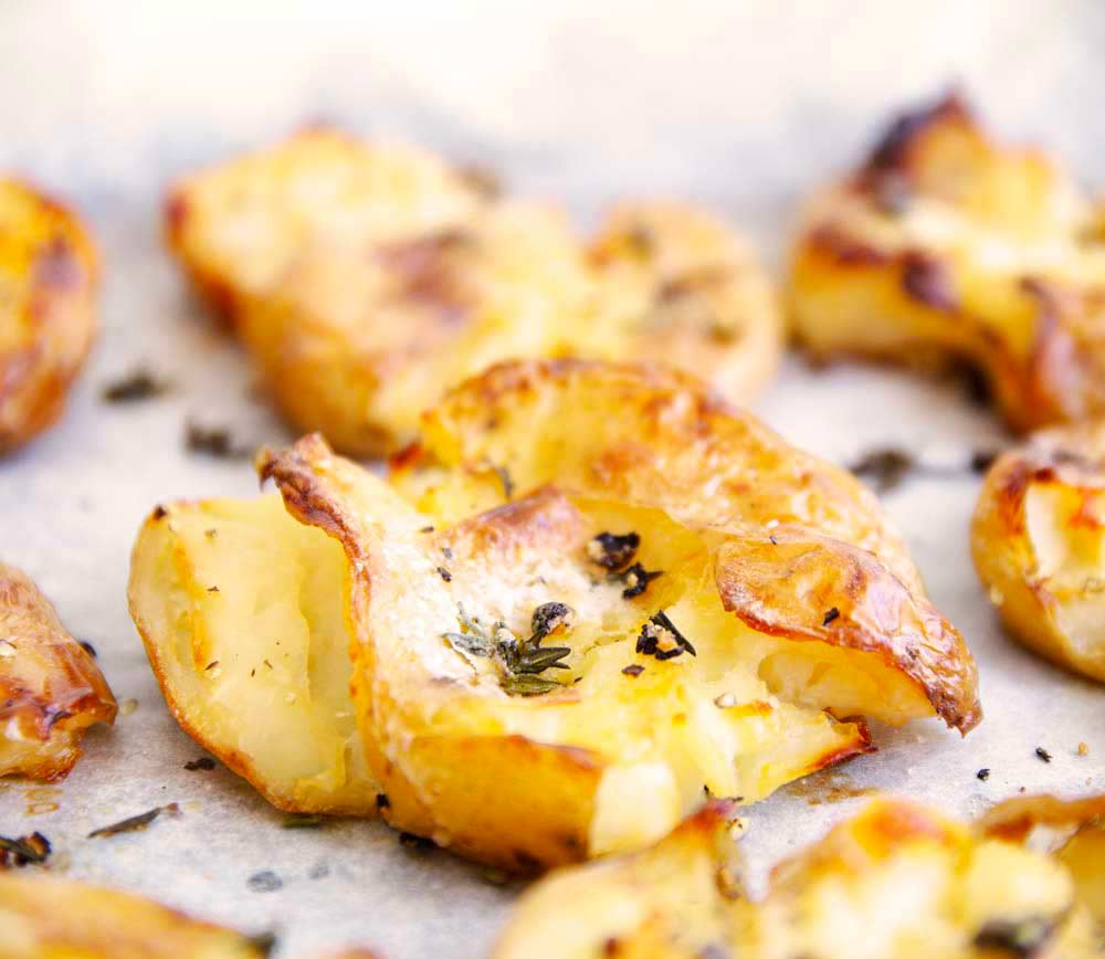 close up on the fluffy insides of a smashed potato